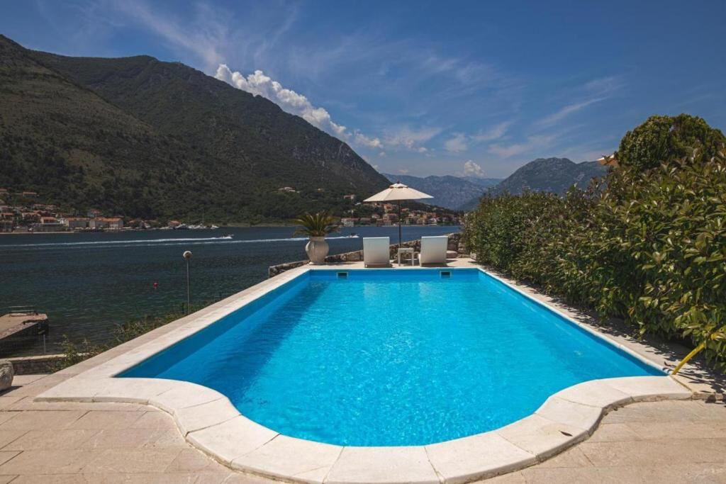 Outdoor swimming pool at Villa Kamena overlooking the Bay of Kotor